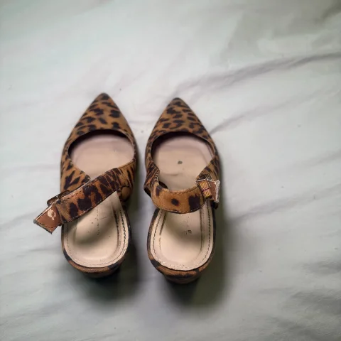 Worn cheetah print heels