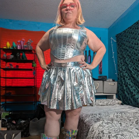 Silver Bustier and Pleated Miniskirt Pics
