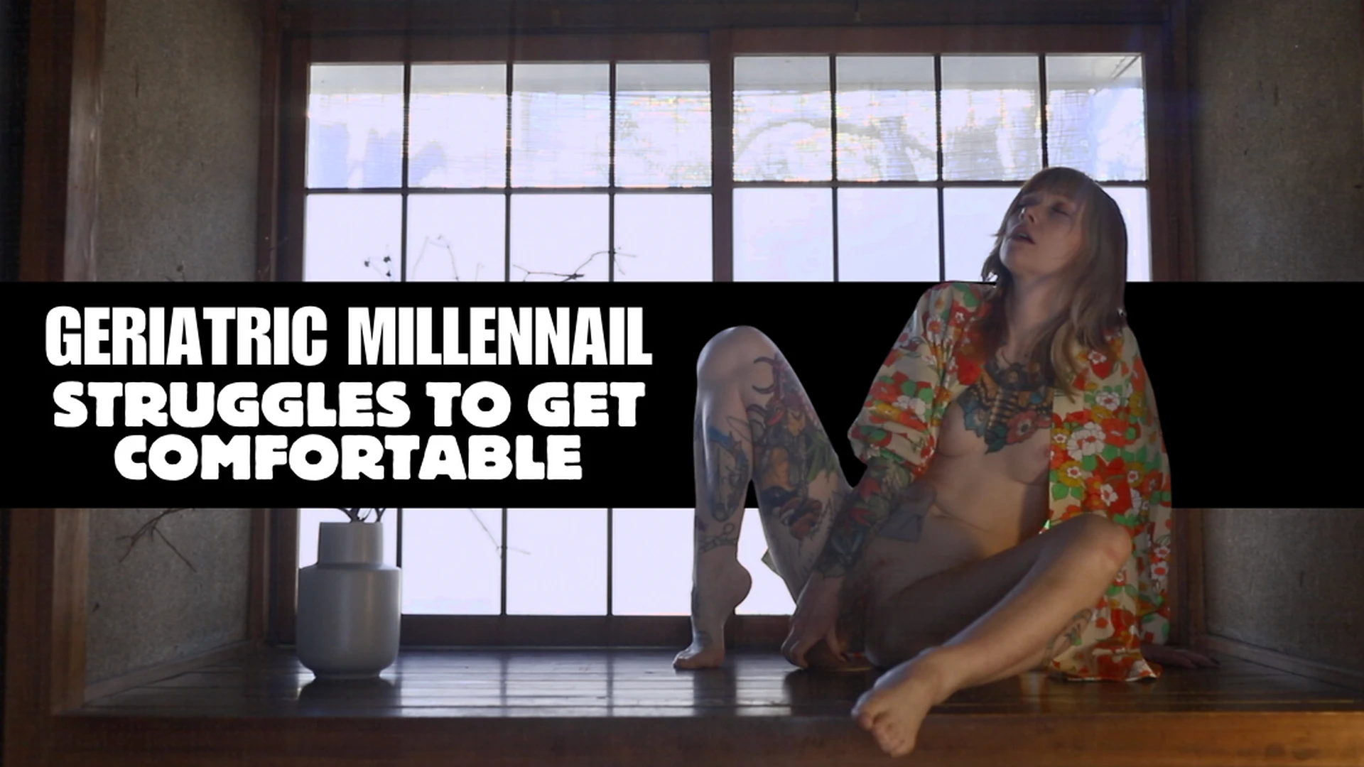 geriatric millennial struggles to get comfortable on wooden surface for 14 min